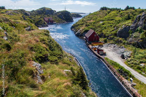 Canal between the islands in the beautiful old fishing village Rovaer in western Norway.