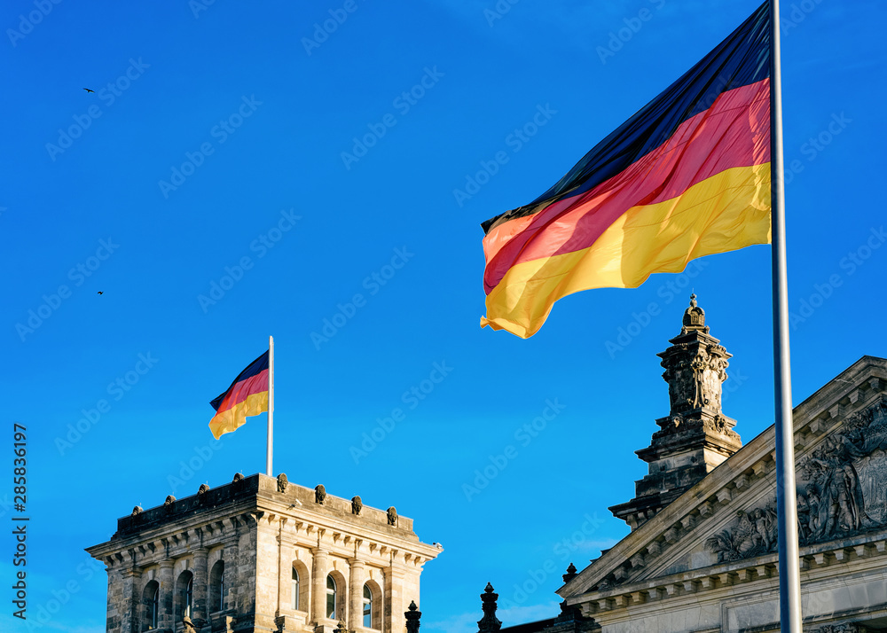 Reichstag building architecture with German Flags in Berlin city center