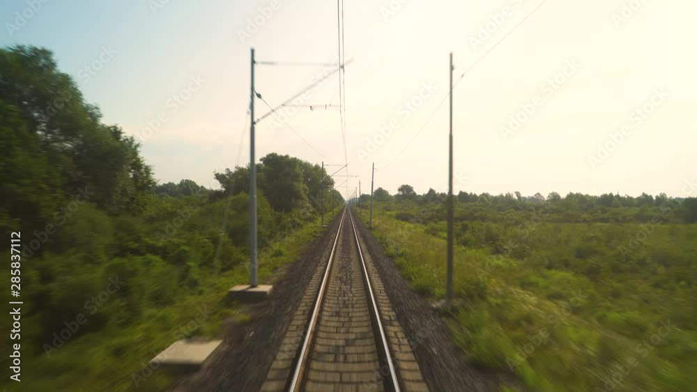 Image of a train moving over rail tracks during the day, Croatia. Image of a train moving over rail tracks during the day, Croatia.