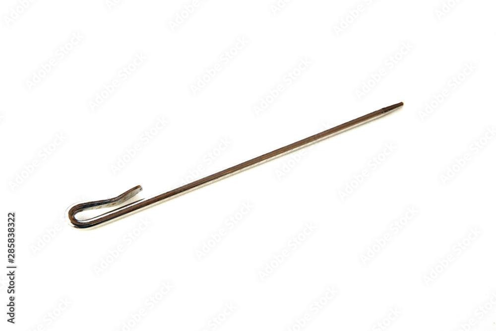 Needle like metal object isolated on white background. This can be used for sewing as well as tidying hair for Sikh boys and men. Needle like metal object isolated on white background. This can be used for sewing as well as tidying hair for Sikh boys and men.