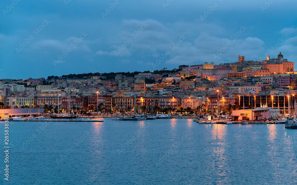 Port with ships in Cagliari at dusk