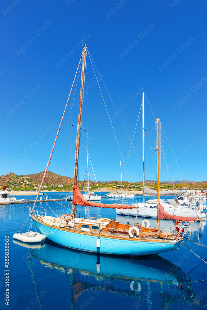Old Sardinian Marina with ships at Mediterranean Sea in Villasimius