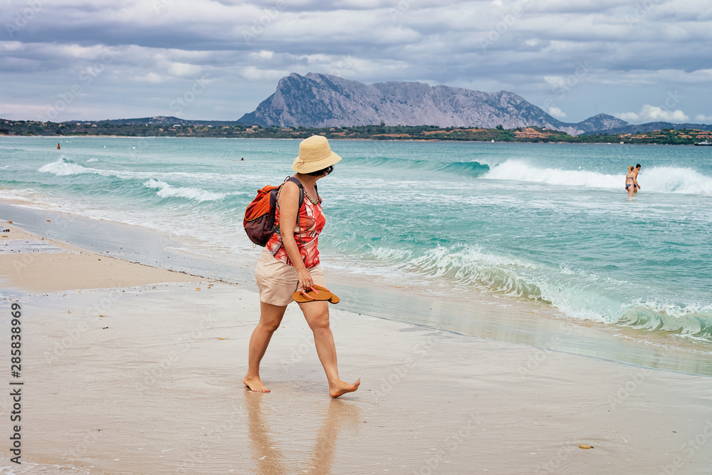 Woman Tourist at La Cinta beach at Mediterranean Sea