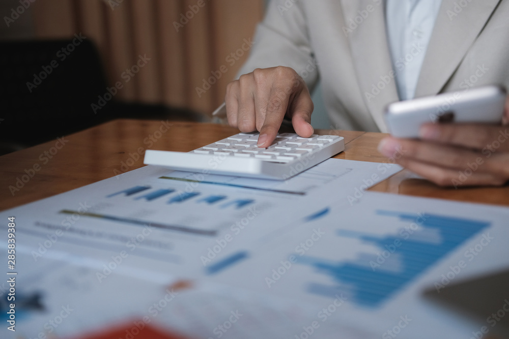 Business concept, Businessman using calculator to calculate loan plan Business concept, Businessman using calculator to calculate loan plan