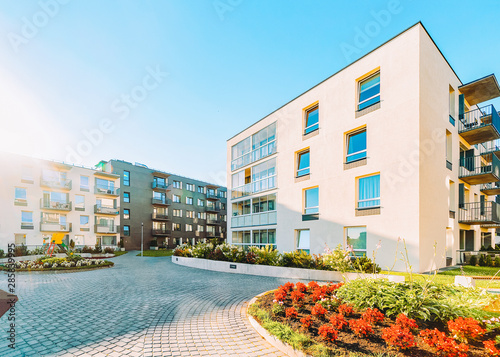 Modern apartment residential buildings with flower plants  outdoor facilities Vilnius
