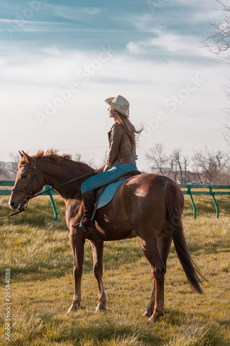 Woman sitting  horse. Day. © erainbow