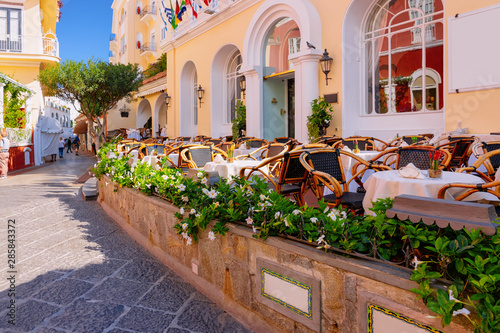 Fototapeta Naklejka Na Ścianę i Meble -  Street cafe and restaurant table with chair Capri Island Italy