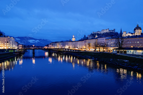 Old city and Hohensalzburg castle near Salzach River Salzburg evening © Roman Babakin