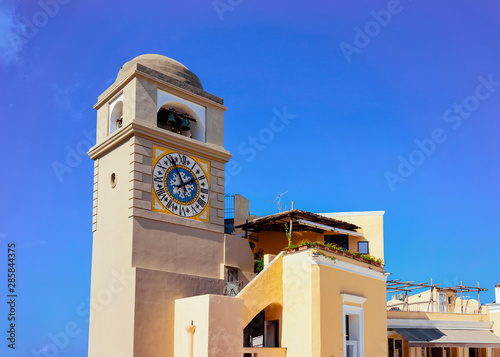 Clock tower of Church Santo Stefano in Capri Island town Fototapet