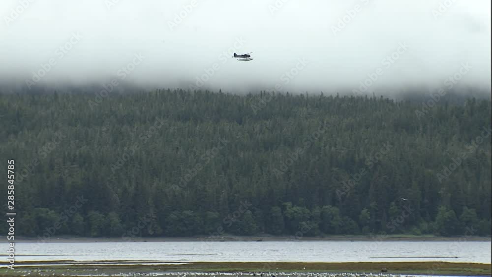 WS float plane flying in alaska bush