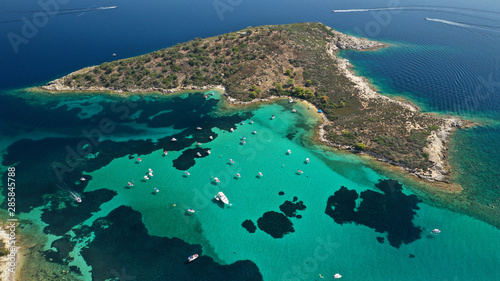 Aerial drone panoramic photo of iconic exotic bay known as blue lagoon in Diaporos island with turquoise clear sea, Vourvourou, Sithonia Peninsula, Halkidiki, North Greece