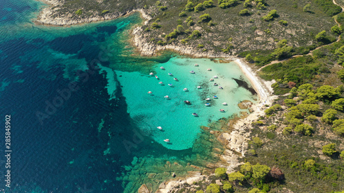 Aerial drone panoramic photo of iconic exotic bay known as blue lagoon in Diaporos island with turquoise clear sea  Vourvourou  Sithonia Peninsula  Halkidiki  North Greece
