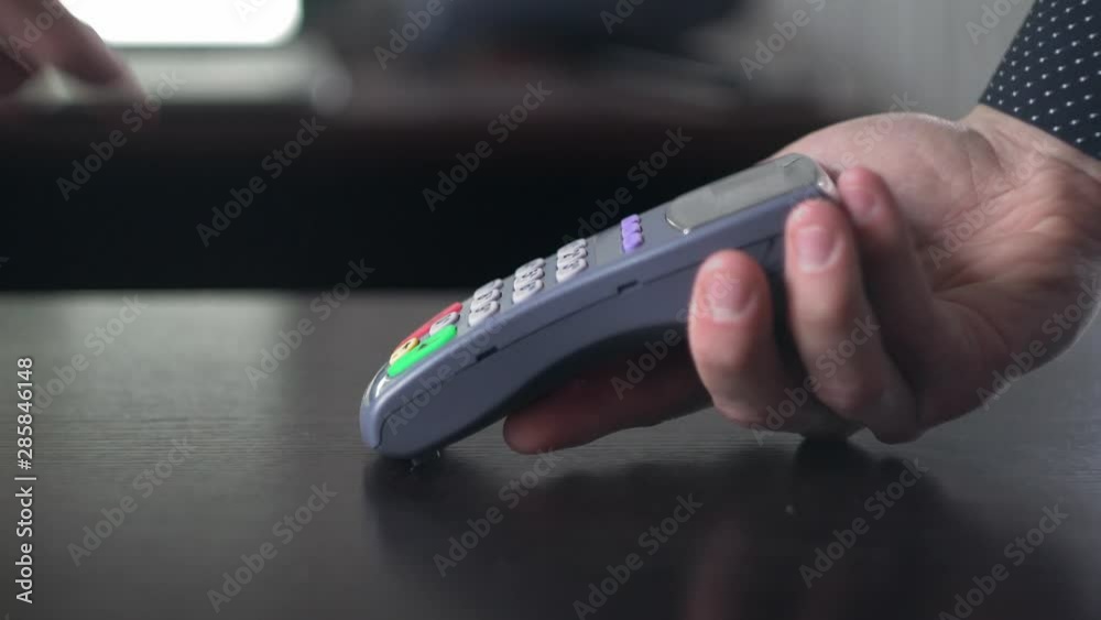 Contactless payment with your smartphone. Paying with a smartphone device on a credit card terminal. Wireless payment. Banking Contactless payment with your smartphone. Paying with a smartphone device on a credit card terminal. Wireless payment. Banking