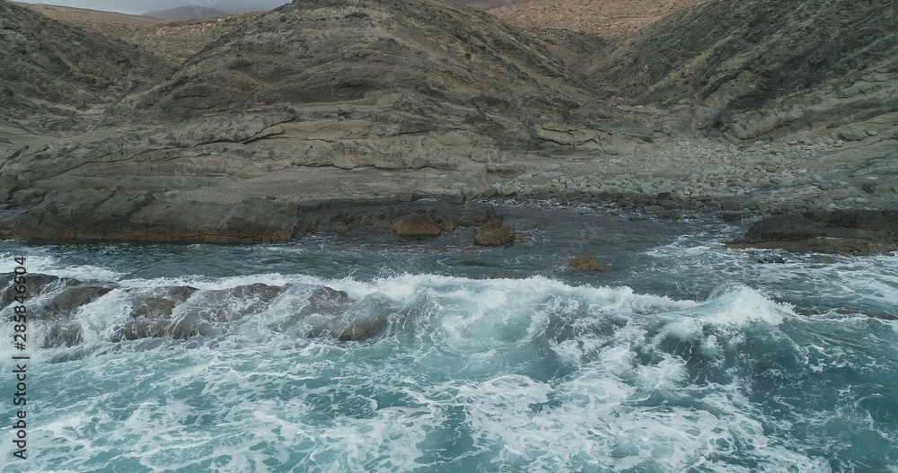 waves crashing on rocks