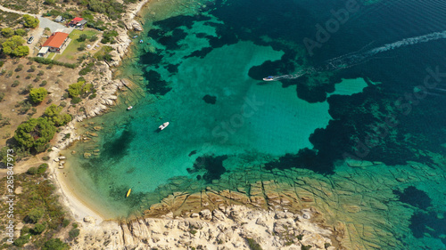 Aerial drone photo of turquoise bay near famous Vourvourou and Diaporos island  Sithonia peninsula  Halkidiki  North Greece