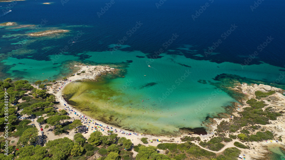 Aerial drone photo of tropical Caribbean bay with white sand beach and beautiful turquoise and sapphire clear sea