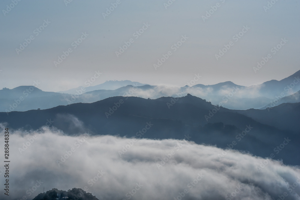 Clouds flowing over the mountains