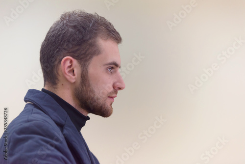 Young male Businessman working on modern computer. Businessman using innovative technologies. Businessman working on computer, software developing with modern tech on virtual screen.