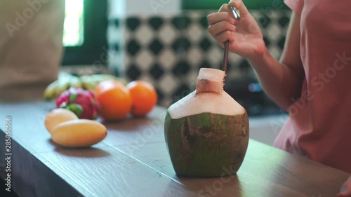 Woman Throwing Plastic Straw and Replaces it with Reusable Metal Straw. Zero waste concept. Drinking Coconut 4K