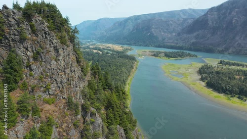 Beacon Rock, an 848-foot (258 m) basalt volcanic plug on the north shore of the Columbia River 32 miles (51 km) east of Vancouver. It was named by Lewis and Clark in 1805.   photo