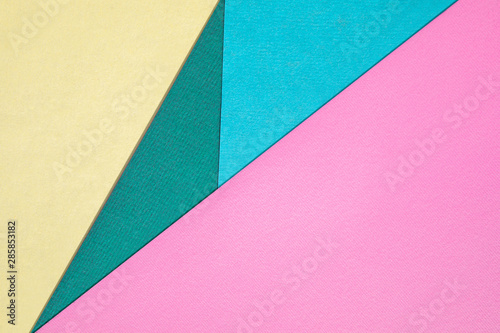 Abstract different pastel colored paper backgrounds with place for text. Diagonal geometric composition. Top view.