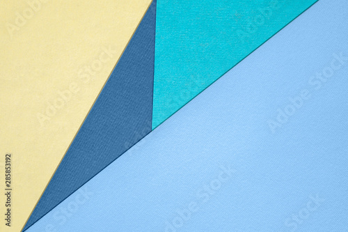 Abstract different pastel colored paper backgrounds with place for text. Diagonal geometric composition. Top view.