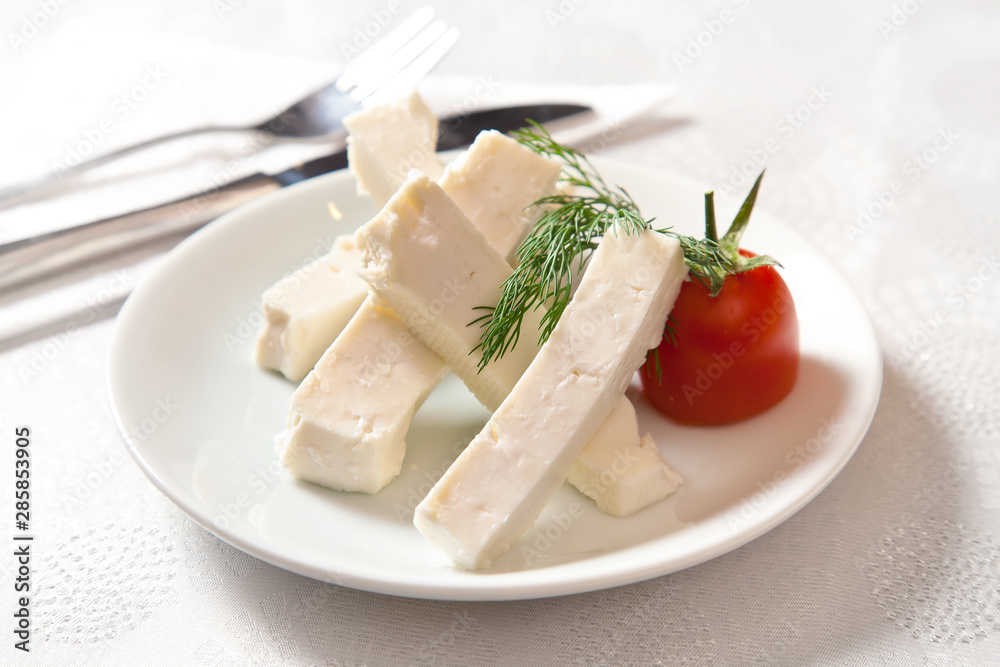 cheese on plate on white background