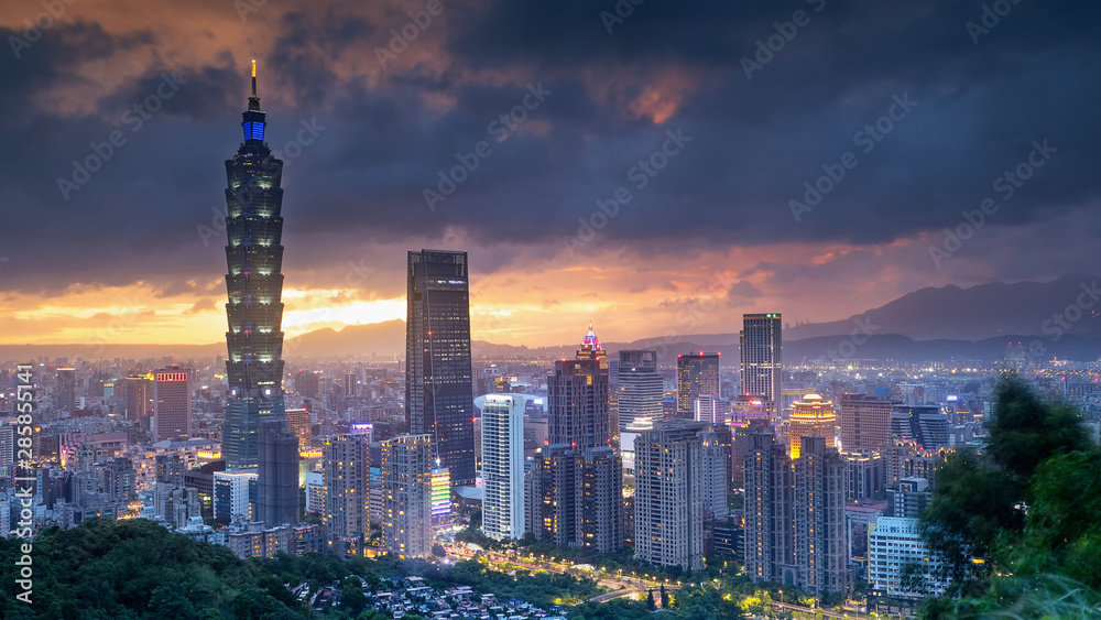 Color cityscape with skyscraper and buildings under blue sky in night in Taipei Taiwan