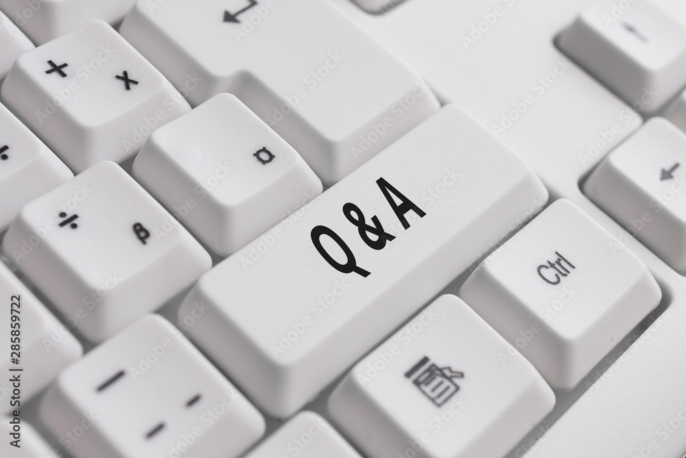Writing note showing Q And A. Business concept for a period of time or an occasion when someone answers questions White pc keyboard with note paper above the white background Writing note showing Q And A. Business concept for a period of time or an occasion when someone answers questions White pc keyboard with note paper above the white background