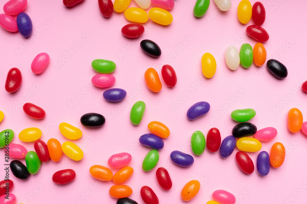 colourful jelly beans candies pink background Top view colourful jelly beans candies pink background Top view
