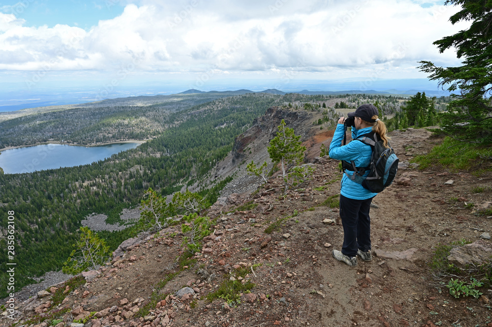 Female hiker enjoying the view from the Tam McArthur Rim Trail in the Three Sisters Wilderness near Sisters, Oregon.