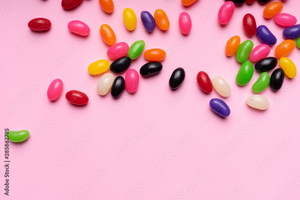colourful jelly beans candies pink background Top view colourful jelly beans candies pink background Top view