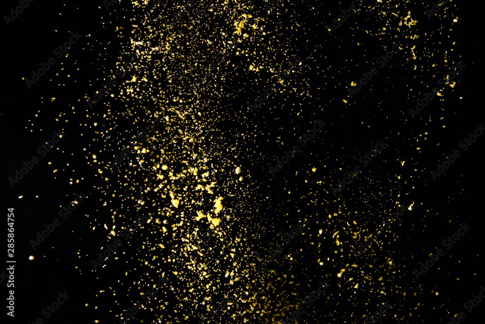 Powder particles on black background