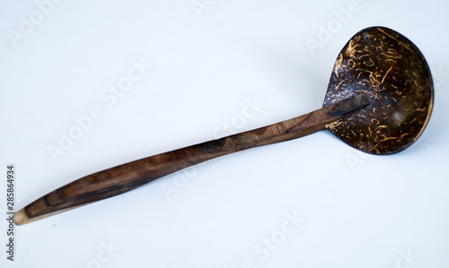 Coconut shell ladle from Indonesia on white background. photo