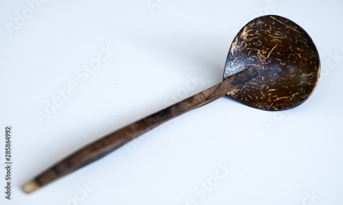 Coconut shell ladle from Indonesia on white background.