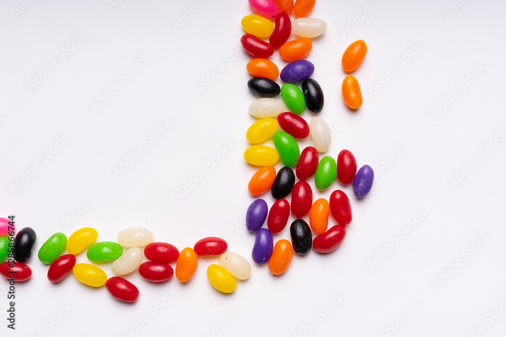 Obraz premium colorful jelly beans candies white background Top view