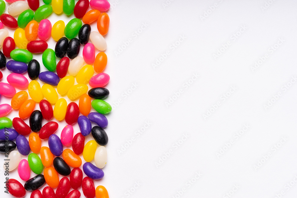 Obraz premium colorful jelly beans candies white background Top view
