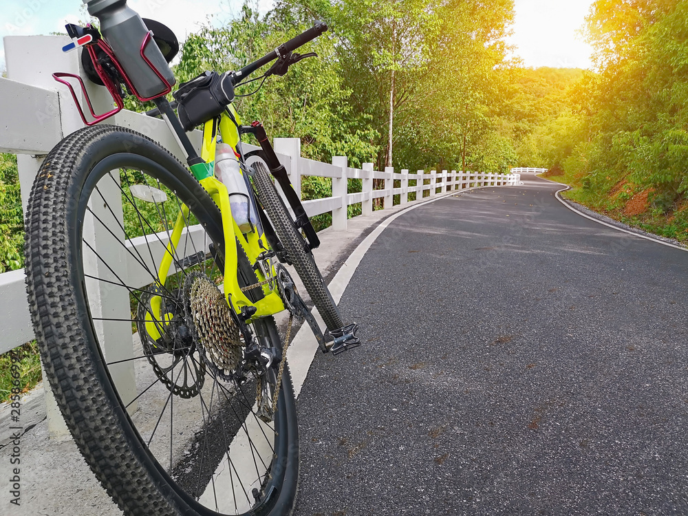 Fototapeta premium Ride a bike in a beautiful road.
