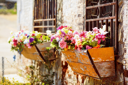 Window box containers of flowers.