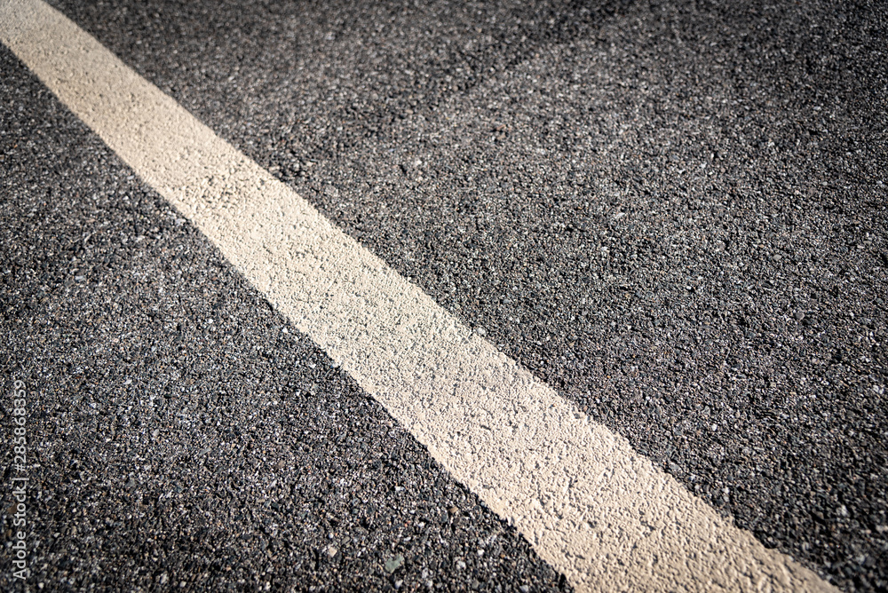 Fototapeta premium Asphalt Street White Line Up Close 