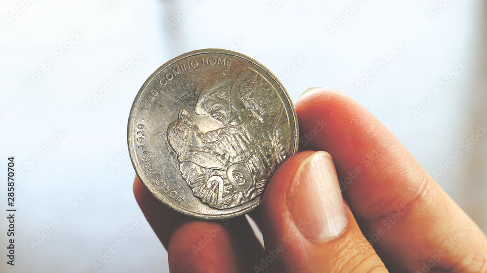 Close the Holding Australian Dollars Coin on Hand and Finger Close the Holding Australian Dollars Coin on Hand and Finger