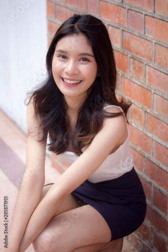 Portrait of thai china adult beautiful girl White shirt relax and smile