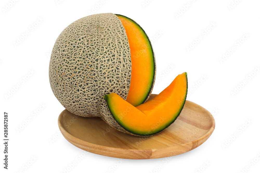 Melon with slice piece on wood round tray isolate on white background Melon with slice piece on wood round tray isolate on white background