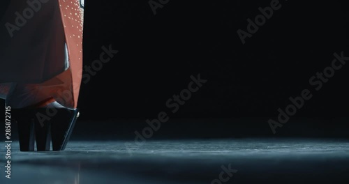 Japanese geisha in traditional kitsune costume and on geta sandals walking on stage while performing a dance - culture concept low angle close up 4k footage photo