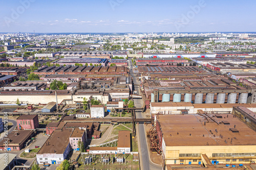 aerial view of industrial district with manufacturing buildings and warehouses