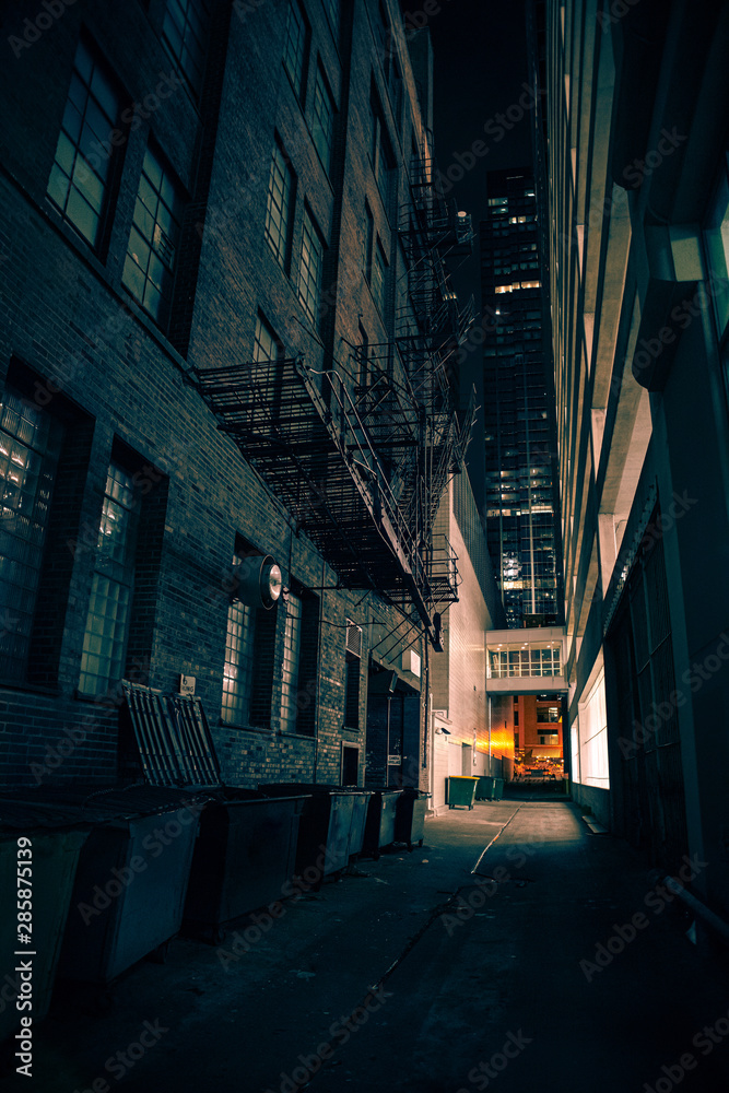 Dark and eerie urban city alley at night Dark and eerie urban city alley at night