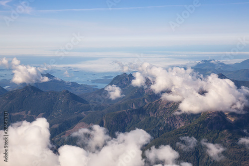 Aerial Landscape View of Beautiful Coastal Mountains on the Pacific Ocean Coast during a sunny summer morning. Taken near Tofino and Ucluelet, Vancouver Island, British Columbia, Canada.