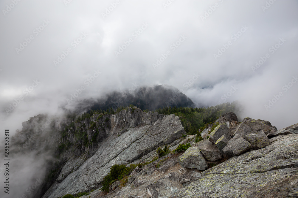 Beautiful View of Canadian Mountain Landscape during a cloudy summer morning. Taken on Crown Mountain, North Vancouver, British Columbia, Canada.