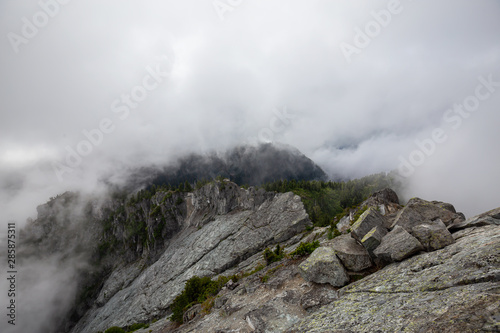 Beautiful View of Canadian Mountain Landscape during a cloudy summer morning. Taken on Crown Mountain  North Vancouver  British Columbia  Canada.