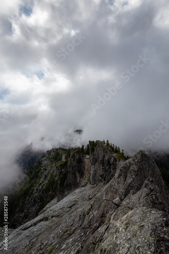 Beautiful View of Canadian Mountain Landscape during a cloudy summer morning. Taken on Crown Mountain, North Vancouver, British Columbia, Canada.